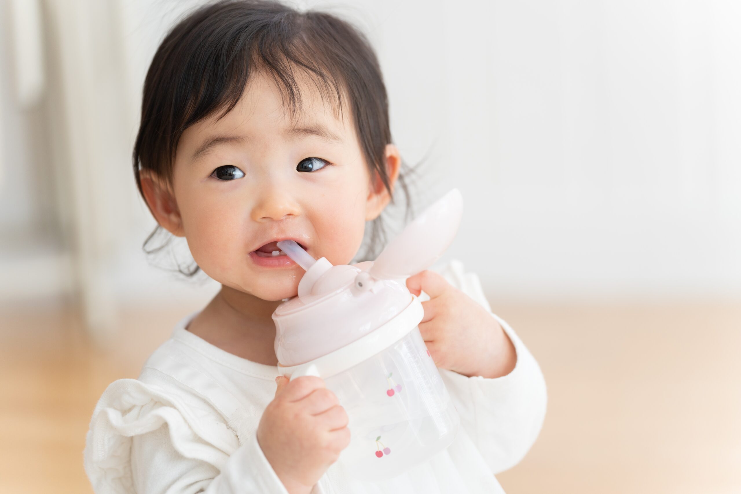 toddler drinking from cup