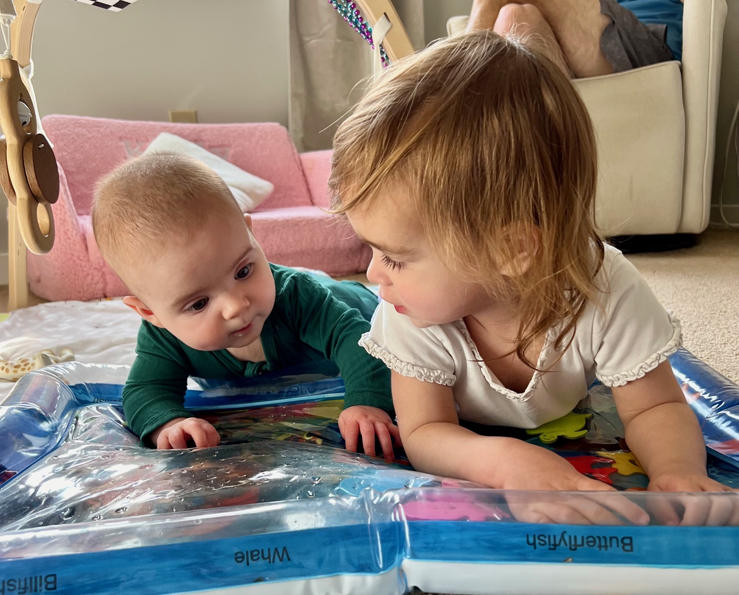 two young kids on floor