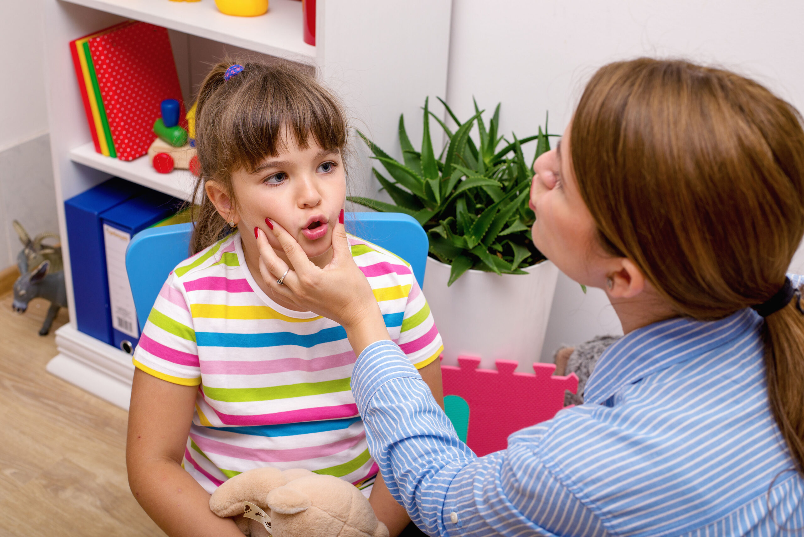 child receiving speech therapy