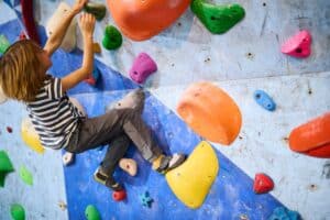 boy rock climbing